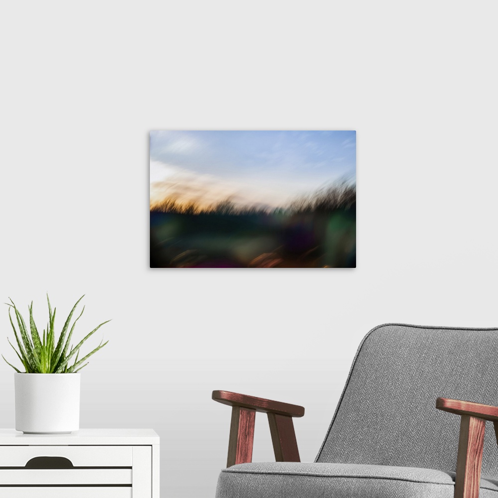 A modern room featuring Cool abstract spring sunset over a forest. Quebec City, Quebec, Canada.