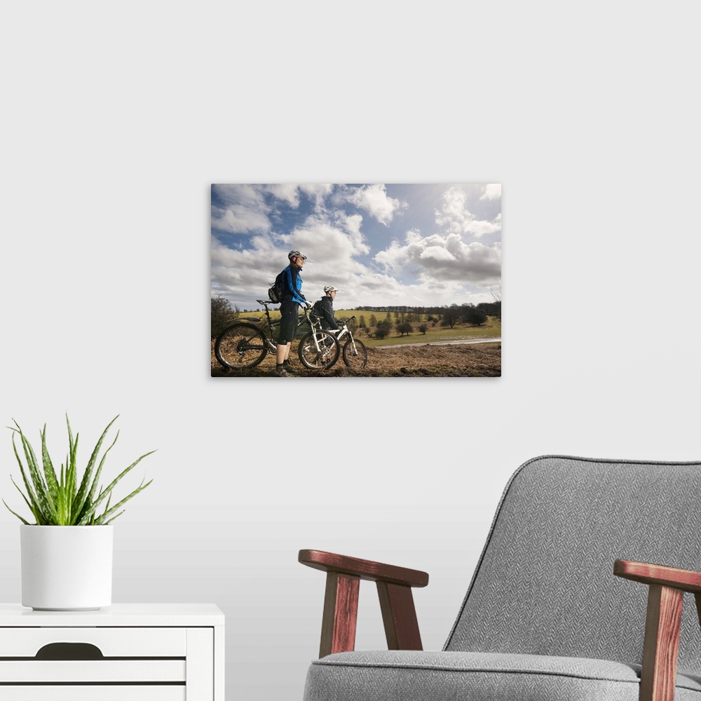 A modern room featuring Couple mountain biking in countryside