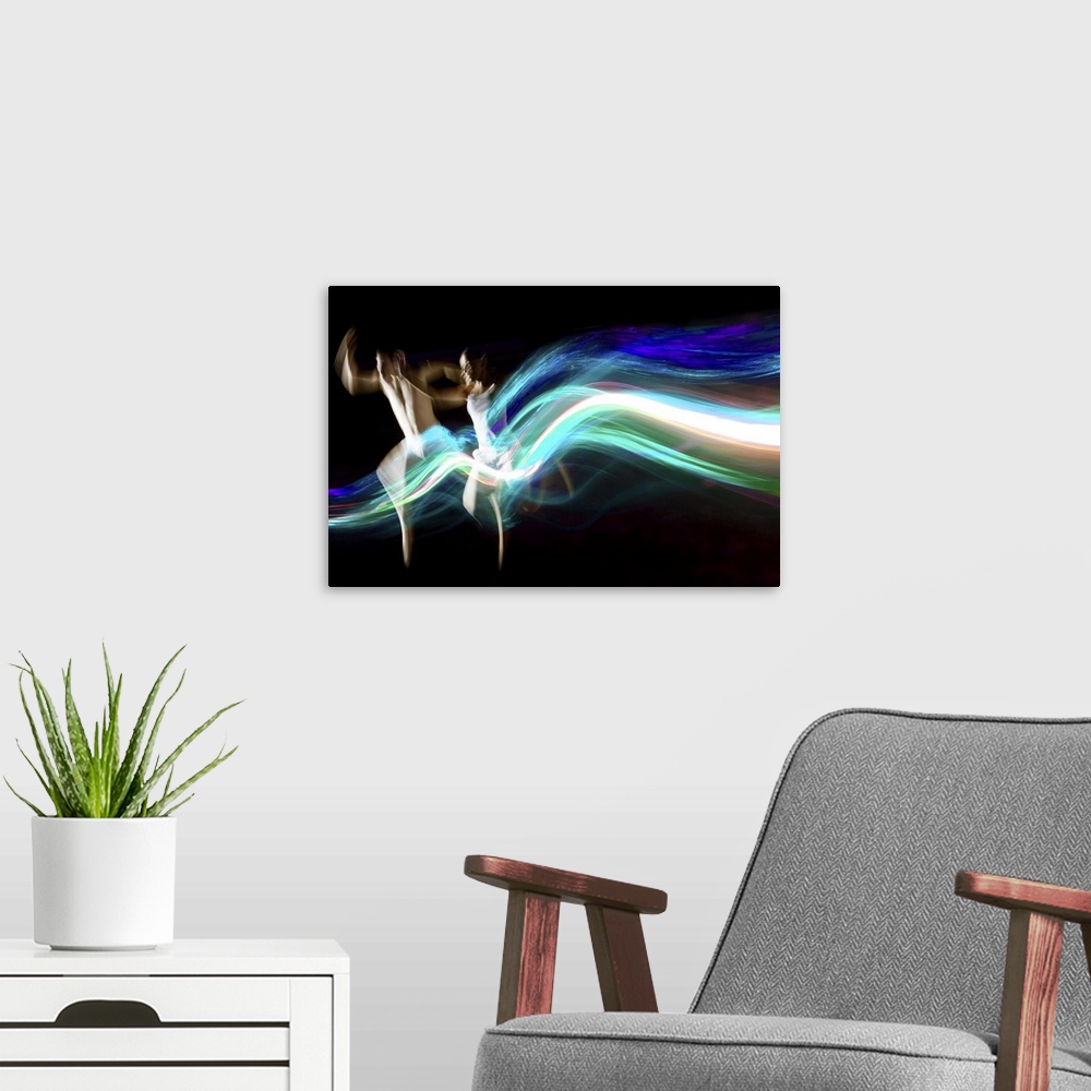 A modern room featuring Dance couple race abstract blue light trails