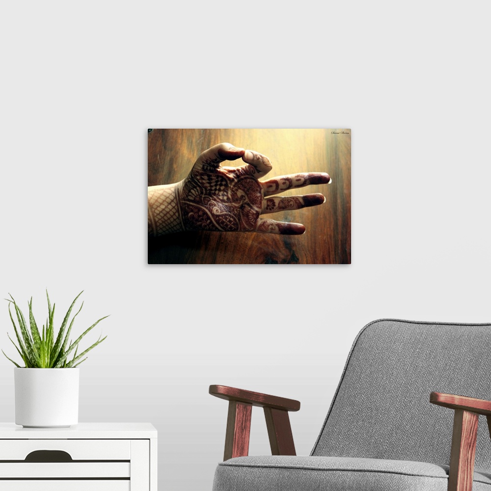 A modern room featuring Mudra or pose of the hand captured in morning light against wooden background.