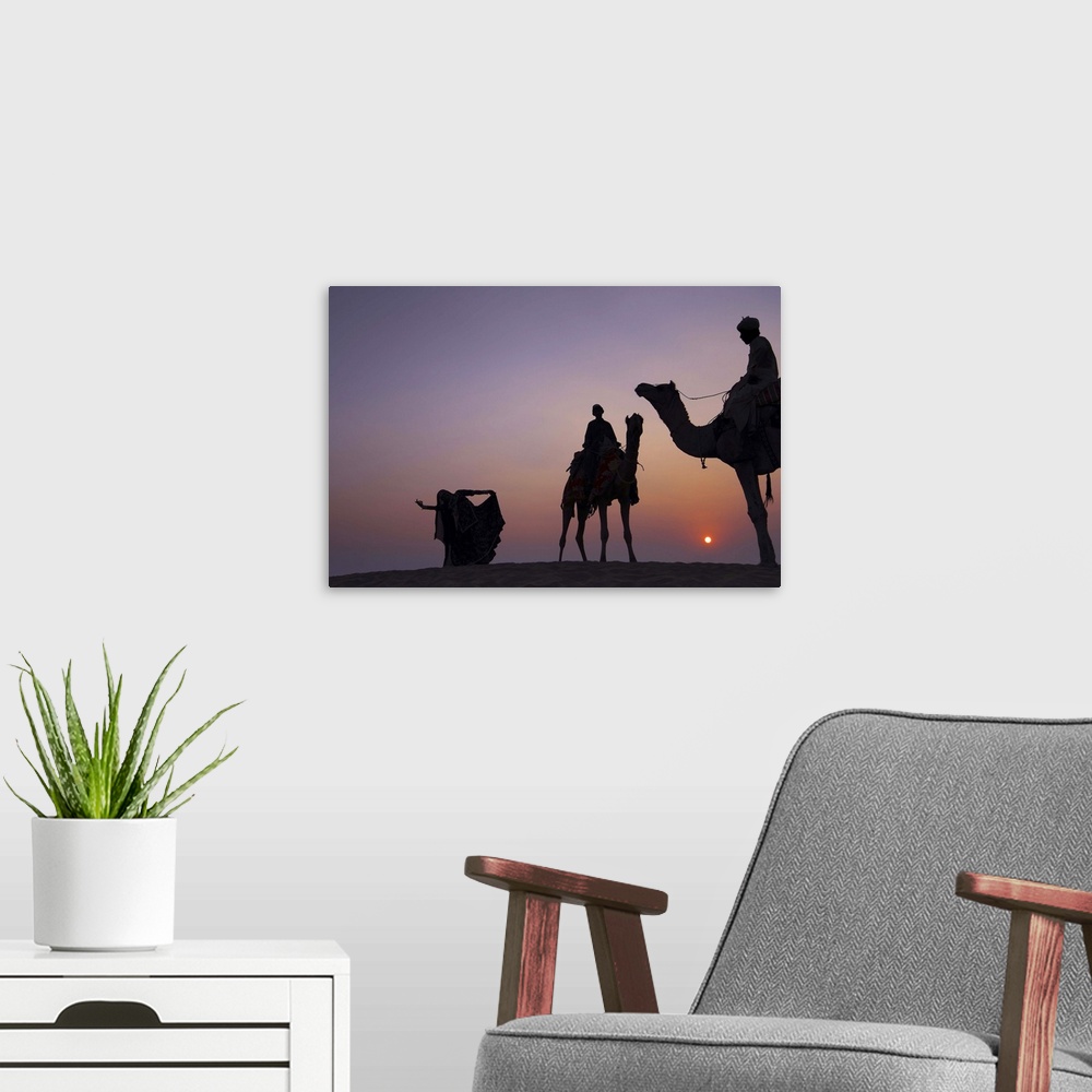 A modern room featuring Silhouette of Folks Dancer and camel herders at Thar desert.