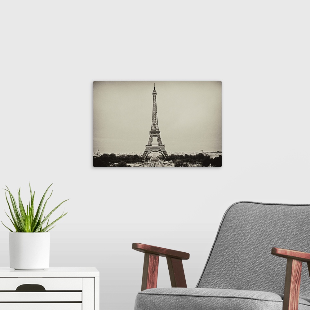 A modern room featuring Eiffel Tower in old style black and white image.