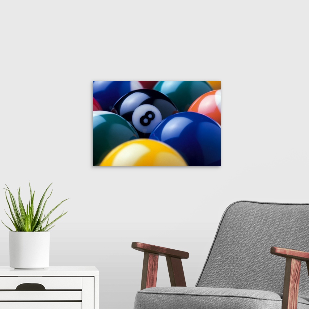 A modern room featuring The focus of this picture is the eight ball as all other pool balls are turned so the number is n...