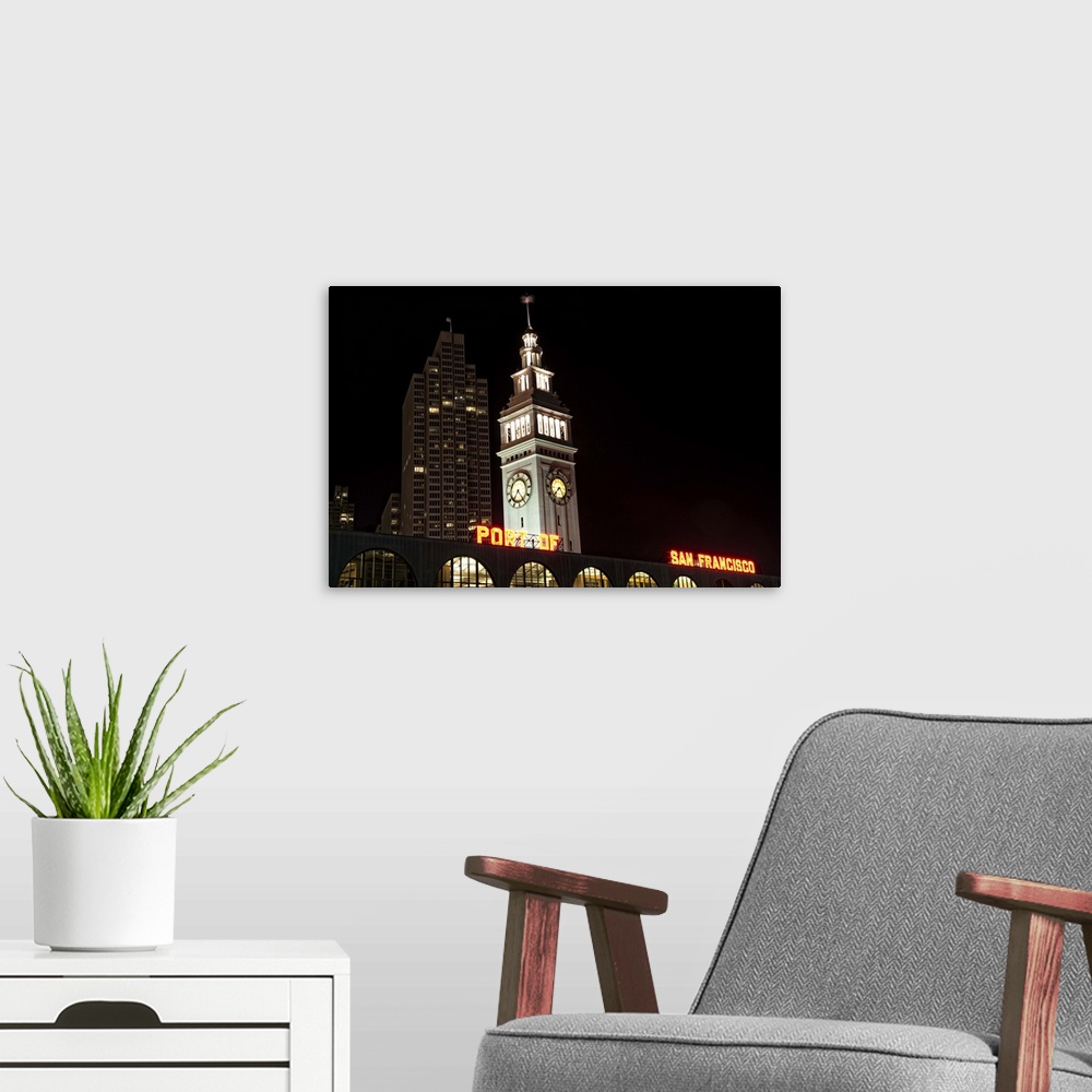 A modern room featuring Ferry Building at night with Port of San Francisco sign.