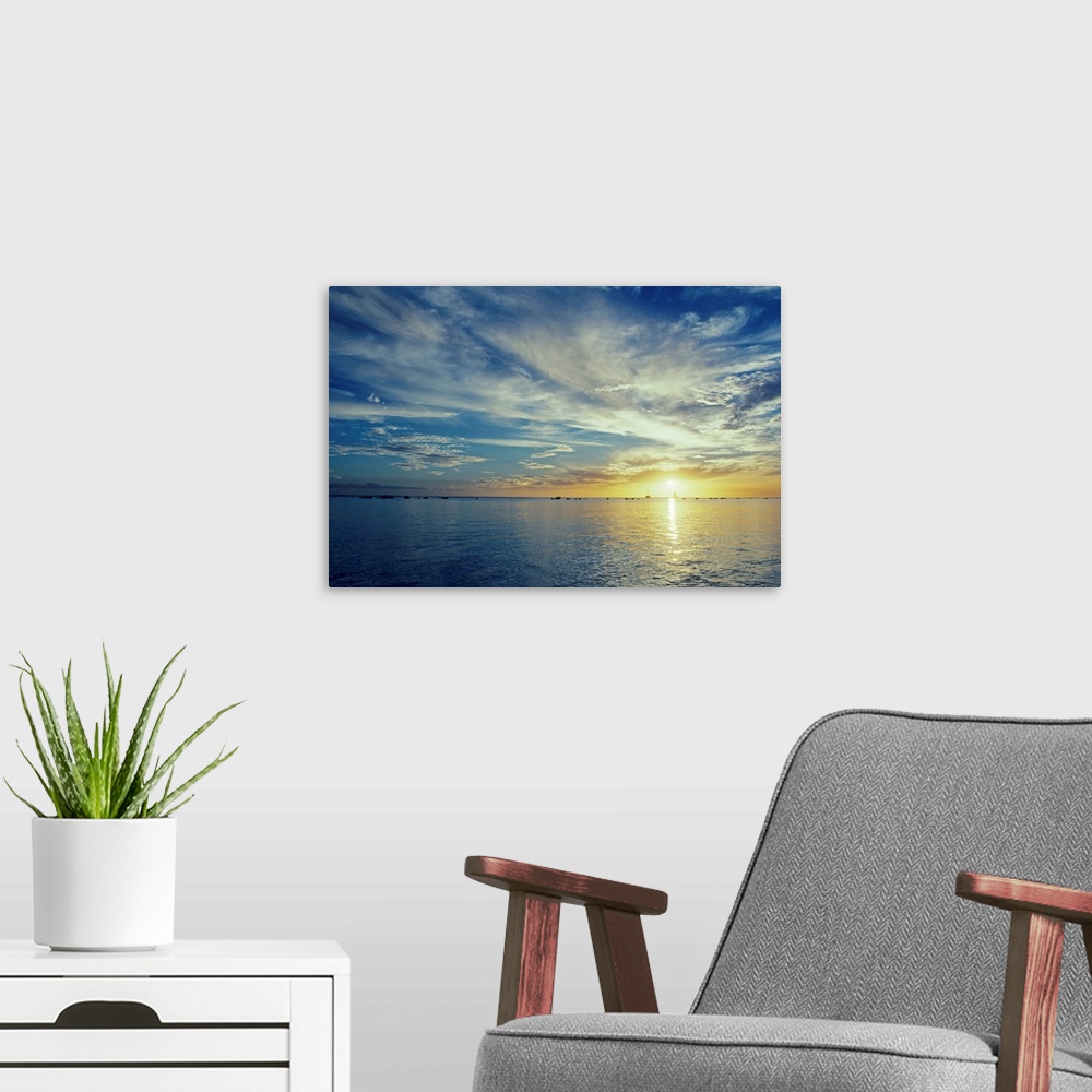 A modern room featuring Hawaii, Sunilight shining through clouds at sunset over the ocean