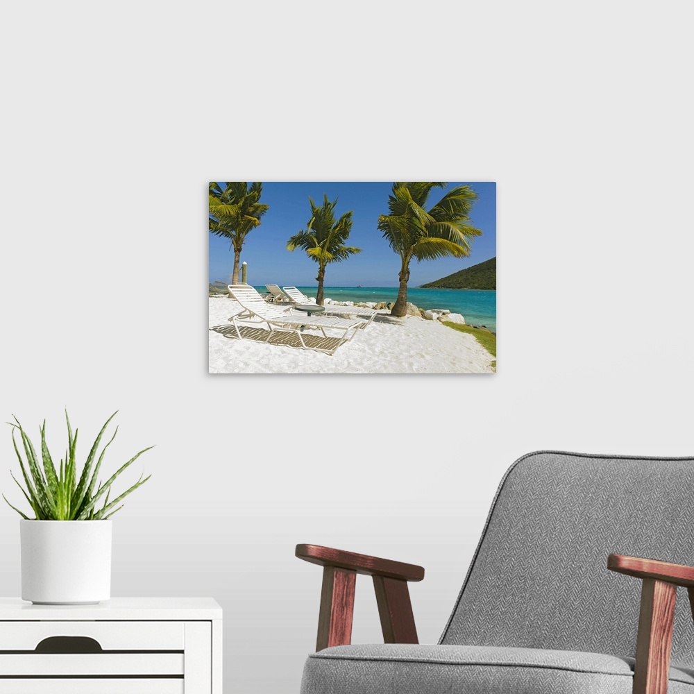 A modern room featuring Idyllic beach with empty lounge chair