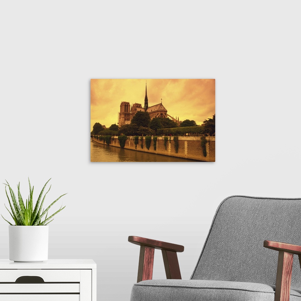 A modern room featuring Image of the Notre Dame and the Seine Next to It By Sunset, Low Angle View, Side View, Paris, France