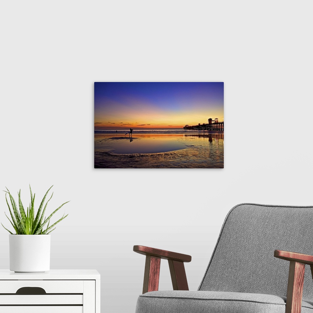 A modern room featuring Surfer enjoys another California sunset.