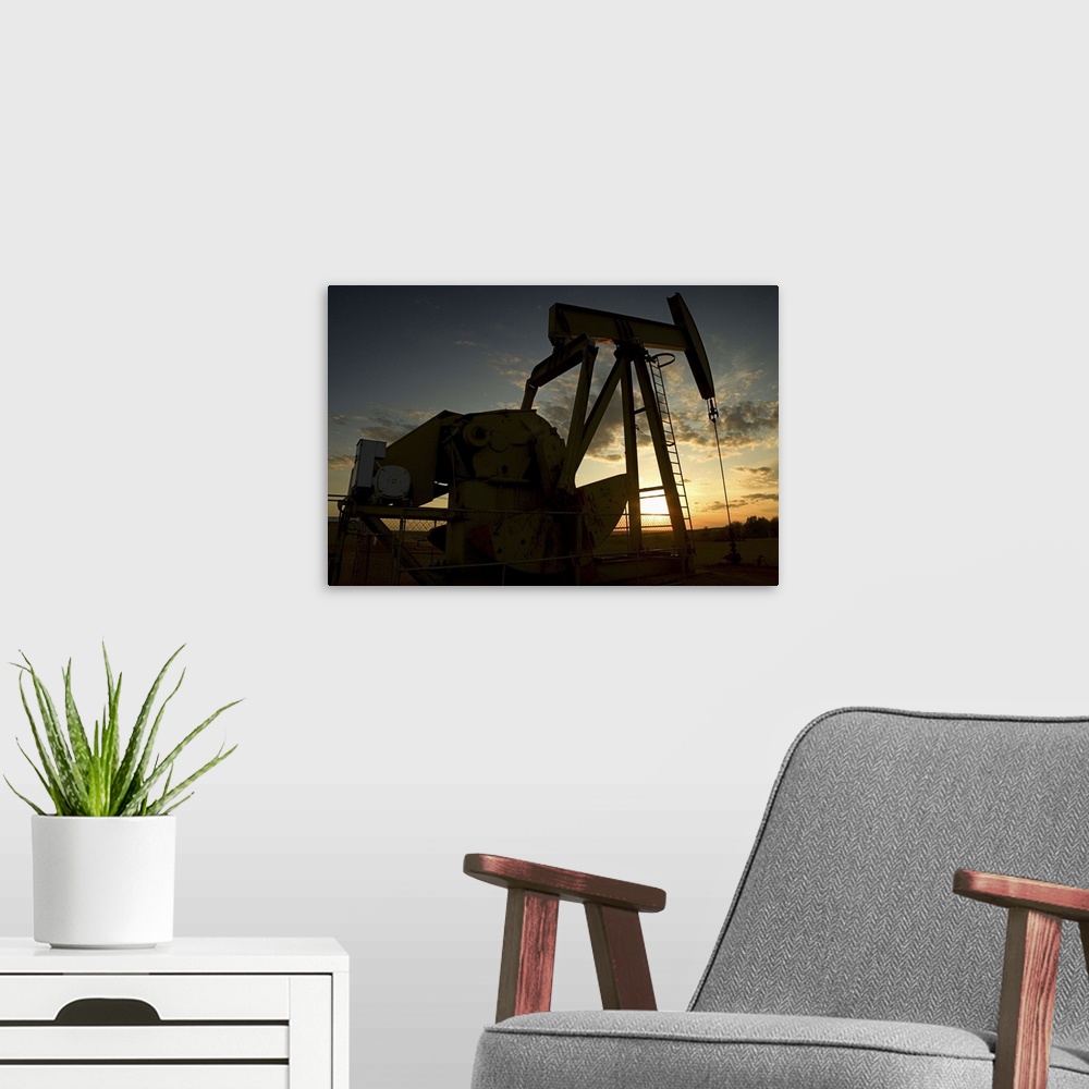 A modern room featuring Oil derrick at sunset