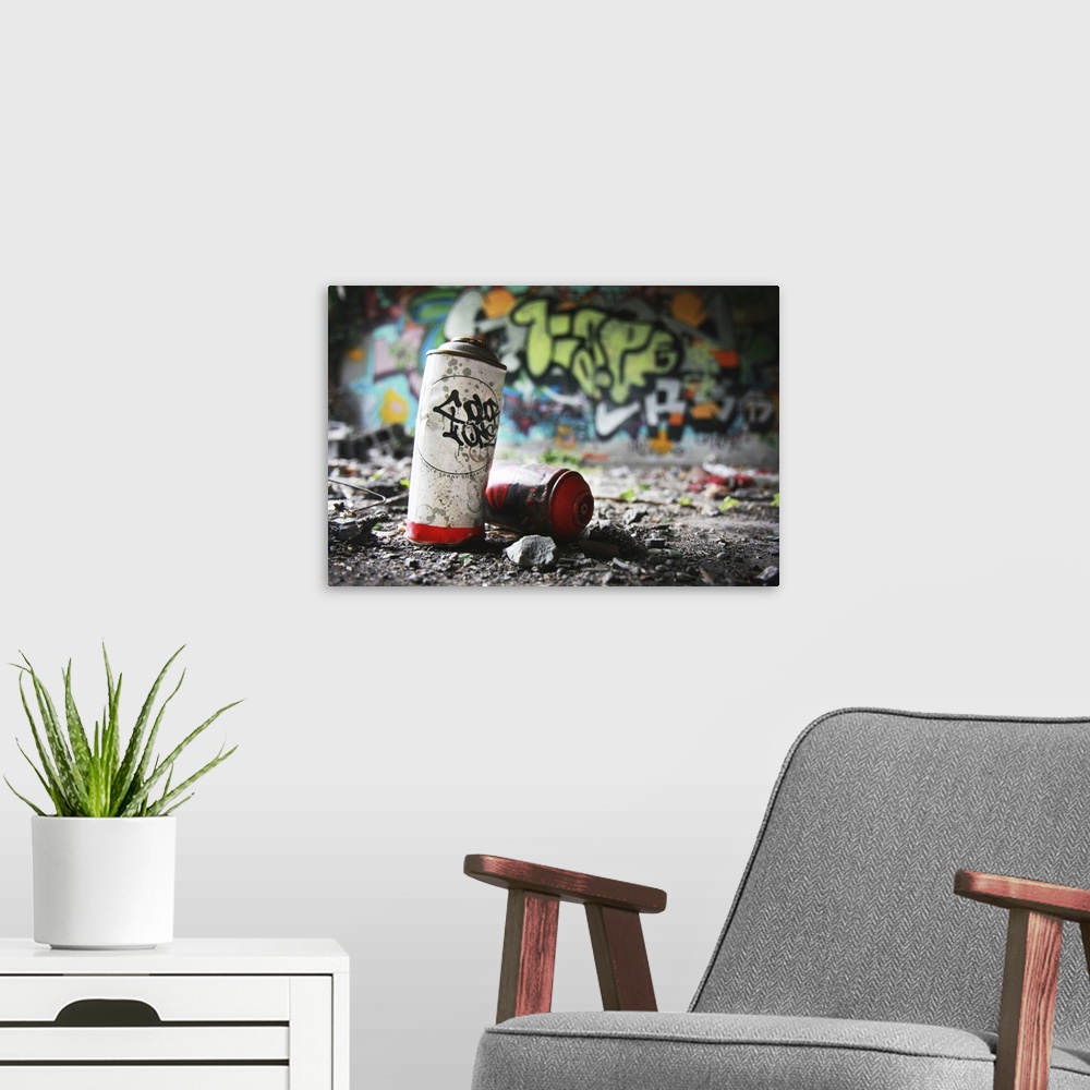 Piece of Evidence - Empty Paint Can in Front of graffiti-covered Wall | Large Canvas Art Print | Great Big Canvas