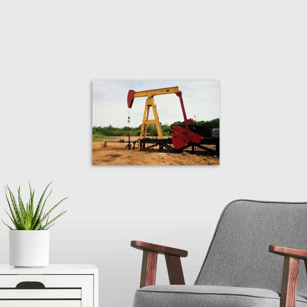 A modern room featuring After an oil well has been located and drilled the pump jack pumps the oil out of the ground.