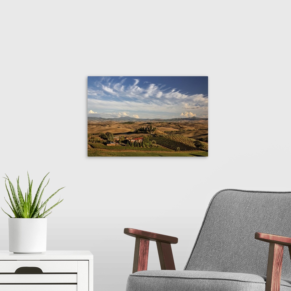 A modern room featuring Rolling farm land after the harvest at sunset