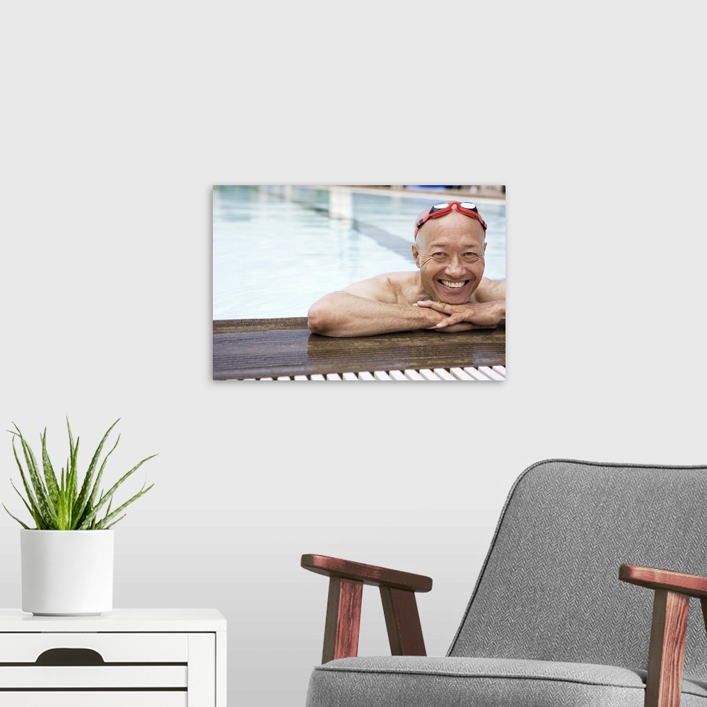 A modern room featuring Smiling senior man swimmer wearing goggles