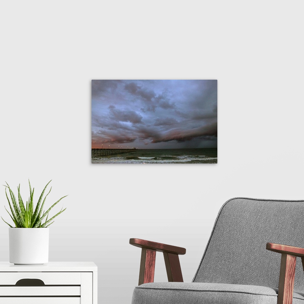 A modern room featuring Stormy sky over ocean, Oak Island, North Carolina