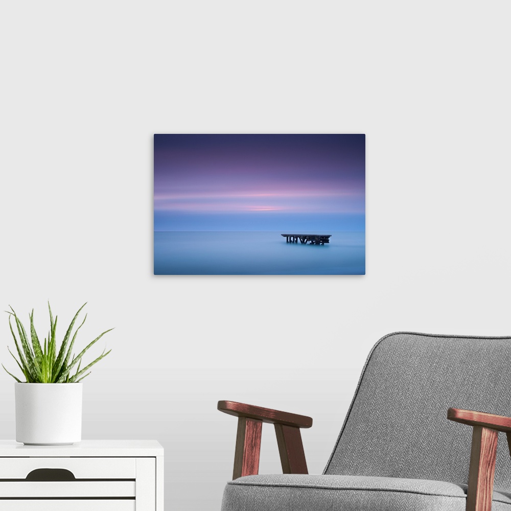 A modern room featuring The sun breaks through the swiftly moving clouds over Lake Michigan.