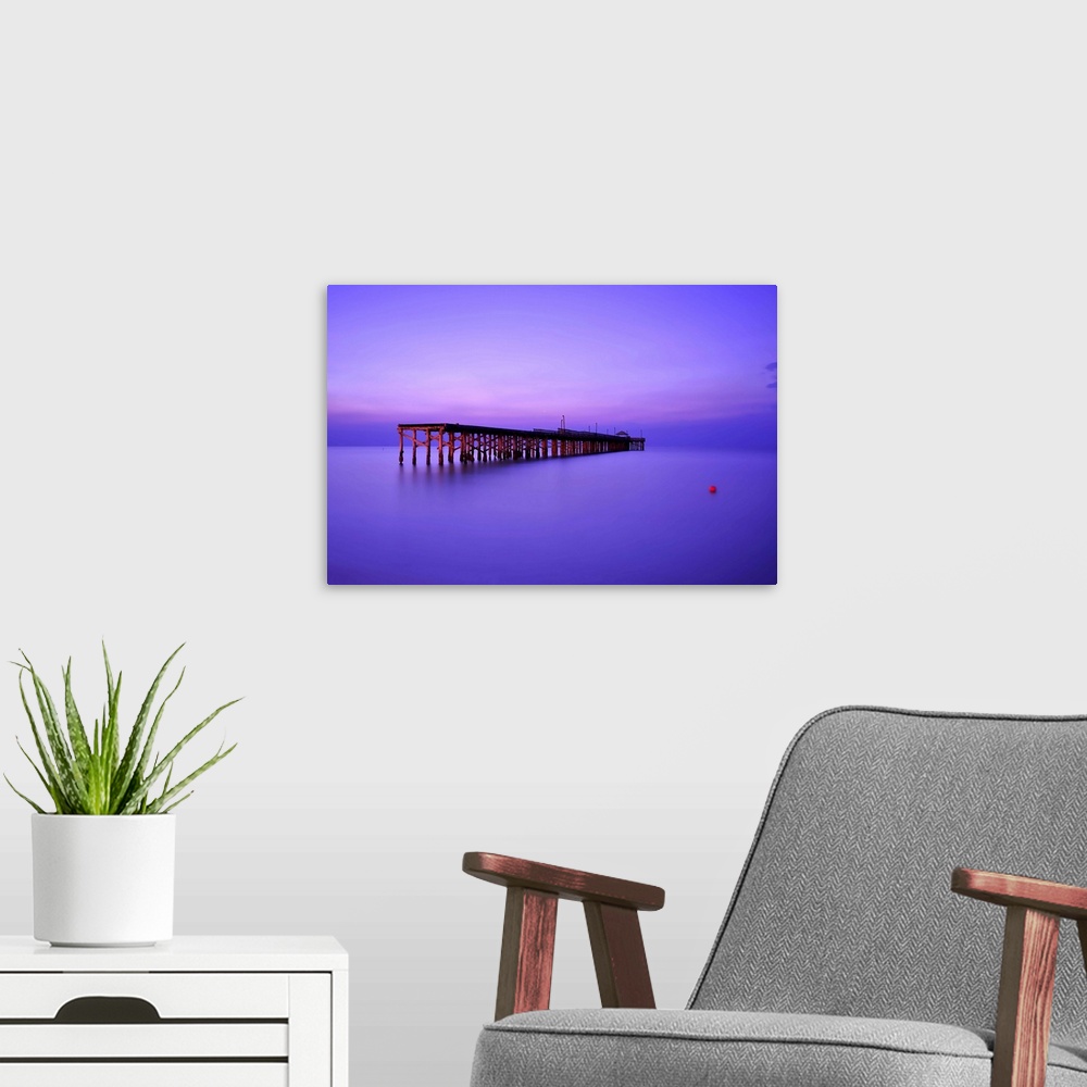 A modern room featuring Sunrise colors of sunny isle beach fishing pier in Miami Dade County, Florida.