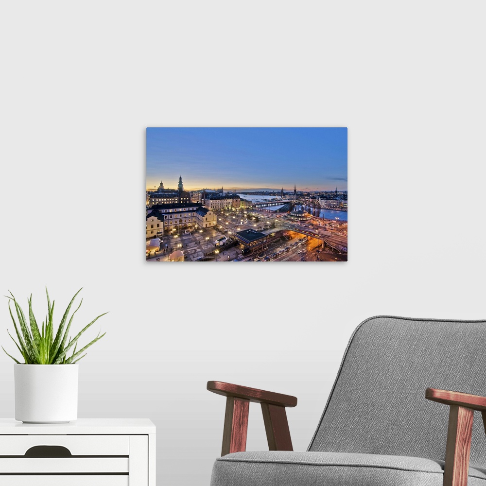 A modern room featuring This is a view over Slussen which is the main traffic central of the island of Sdermalm. The gree...