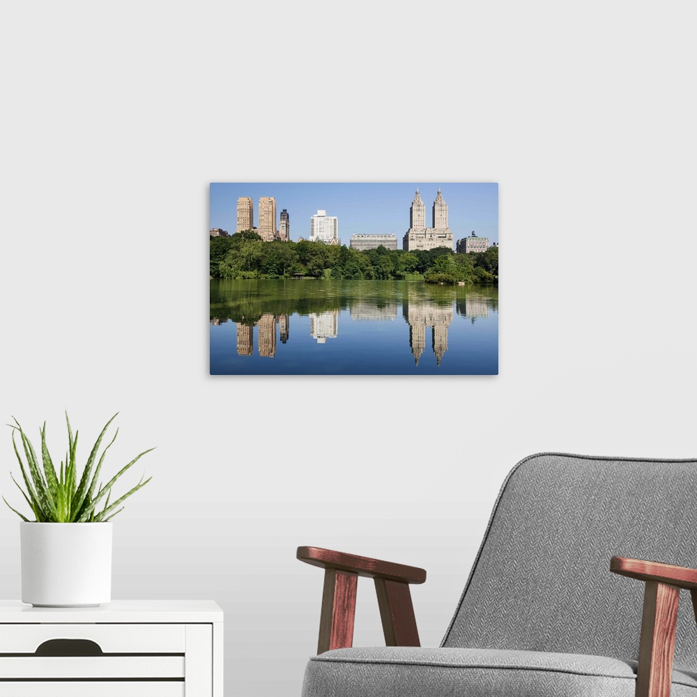 A modern room featuring San Remo Apartments and other buildings on Central Park West, viewed from The lake in Central Par...