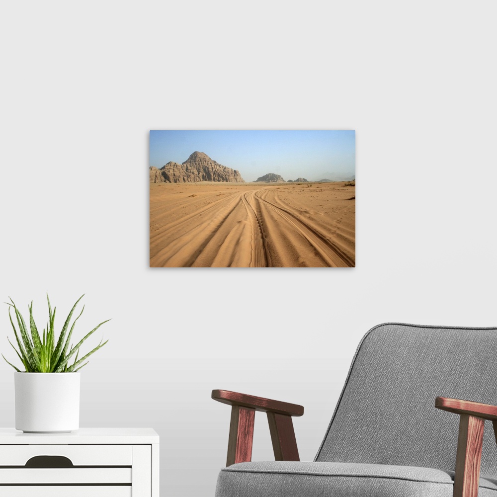 A modern room featuring Tracks in sand, Wadi Rum, Jordan.