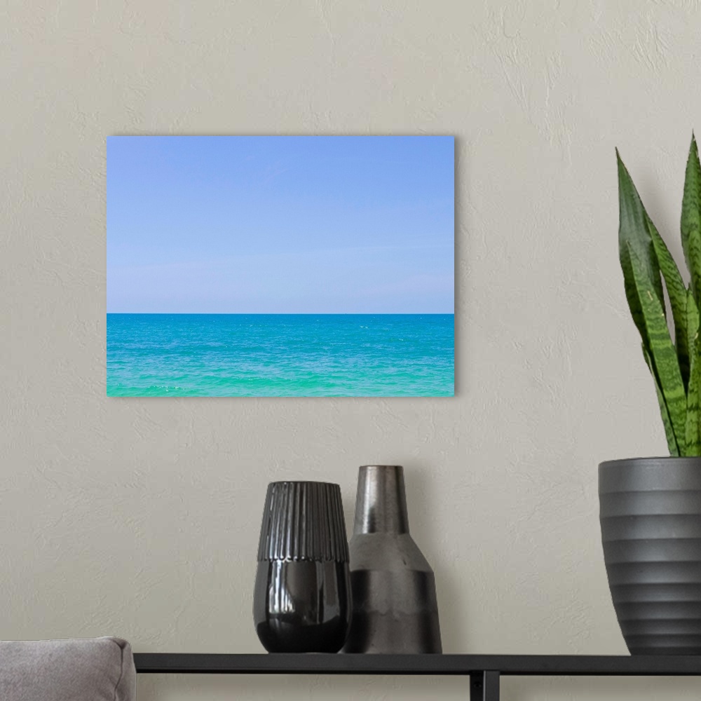 A modern room featuring Tropical blue sea and sky.