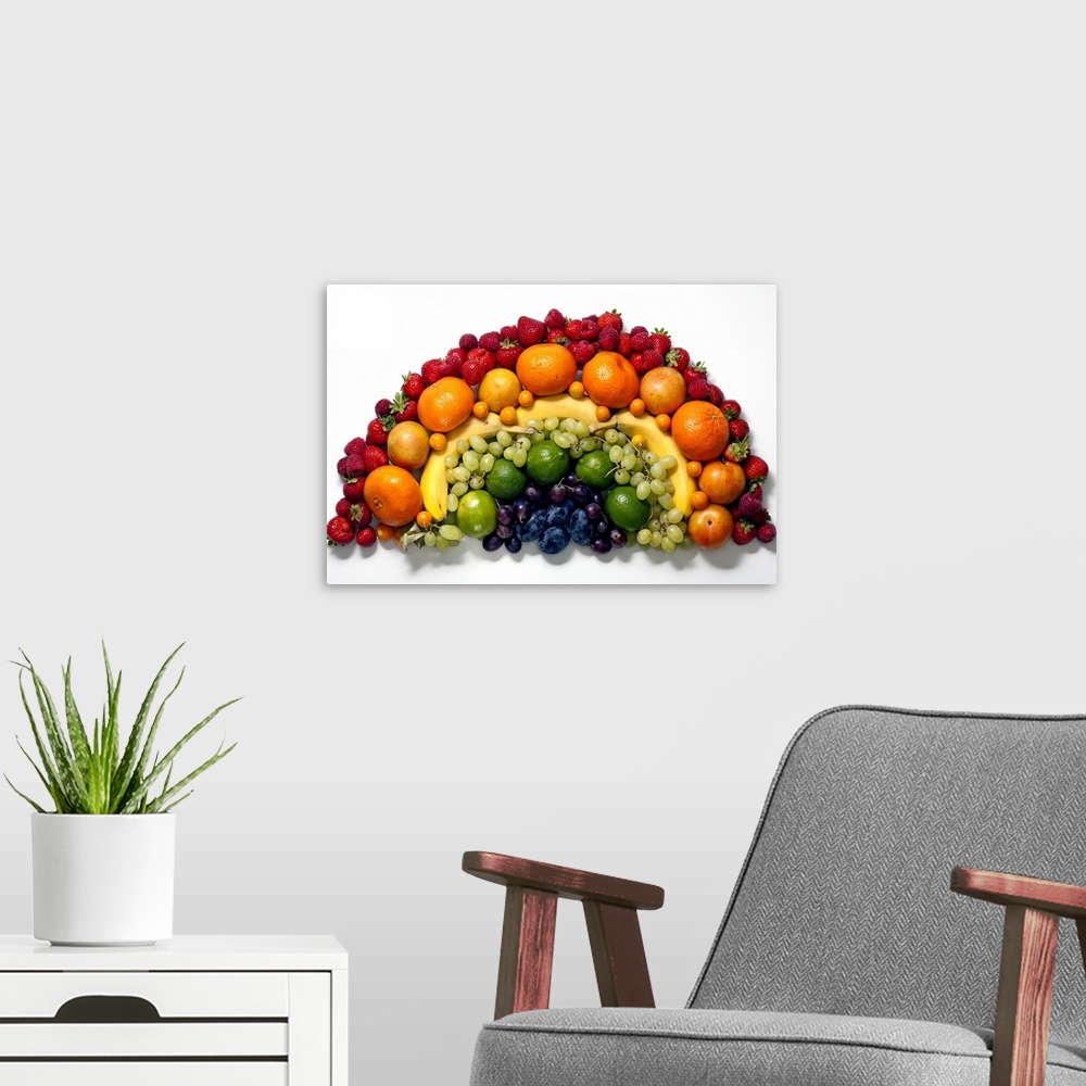 A modern room featuring Various fruits arranged into the shape of a rainbow