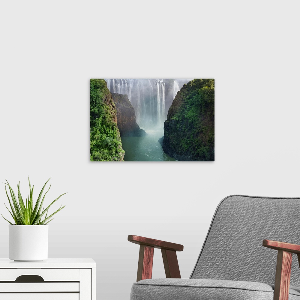 A modern room featuring Zimbabwe side of Victoria Falls, (Mosi-oa-Tunya). Victoria Falls is a waterfall of 355ft (109m) o...