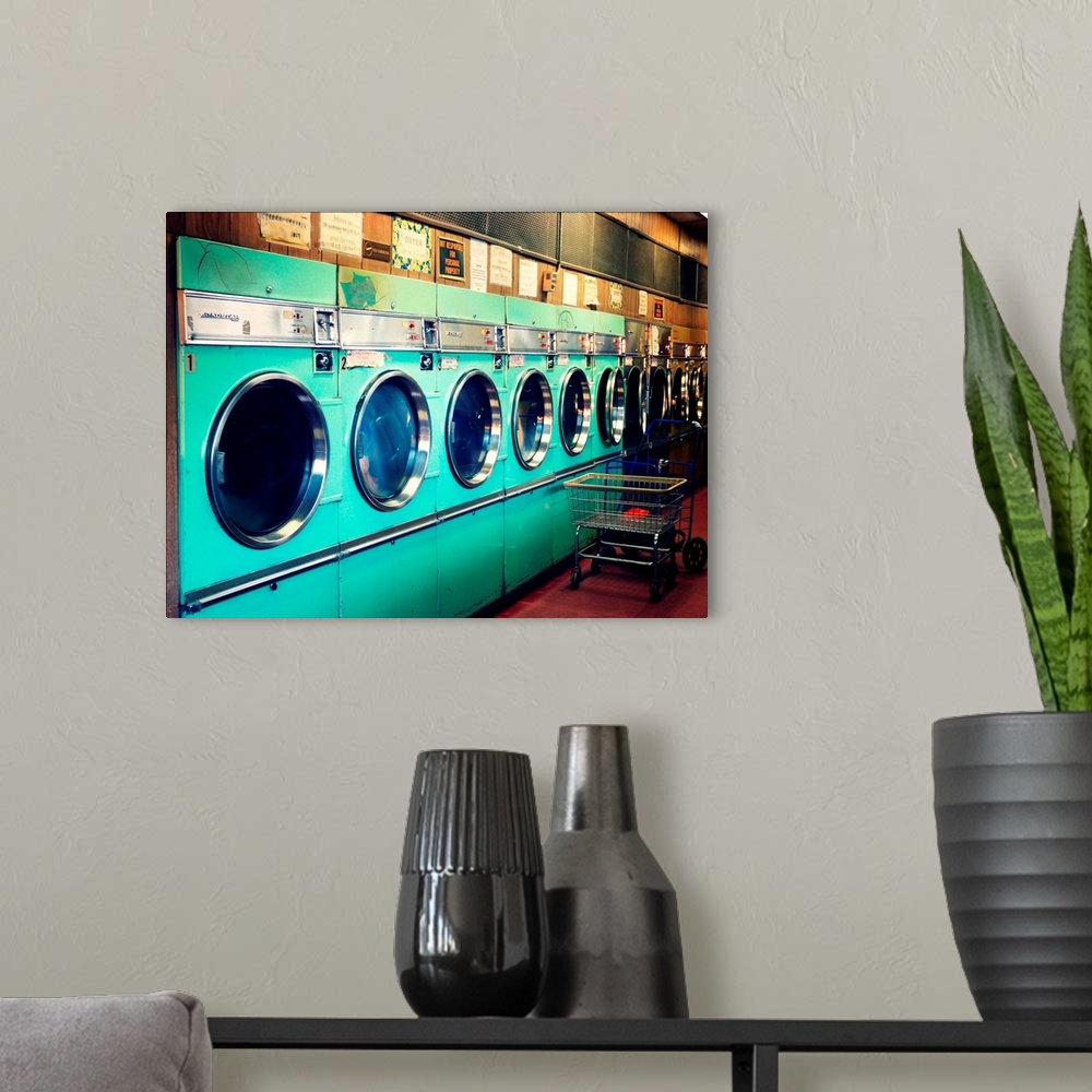 A modern room featuring Washing machines in Laundromat.