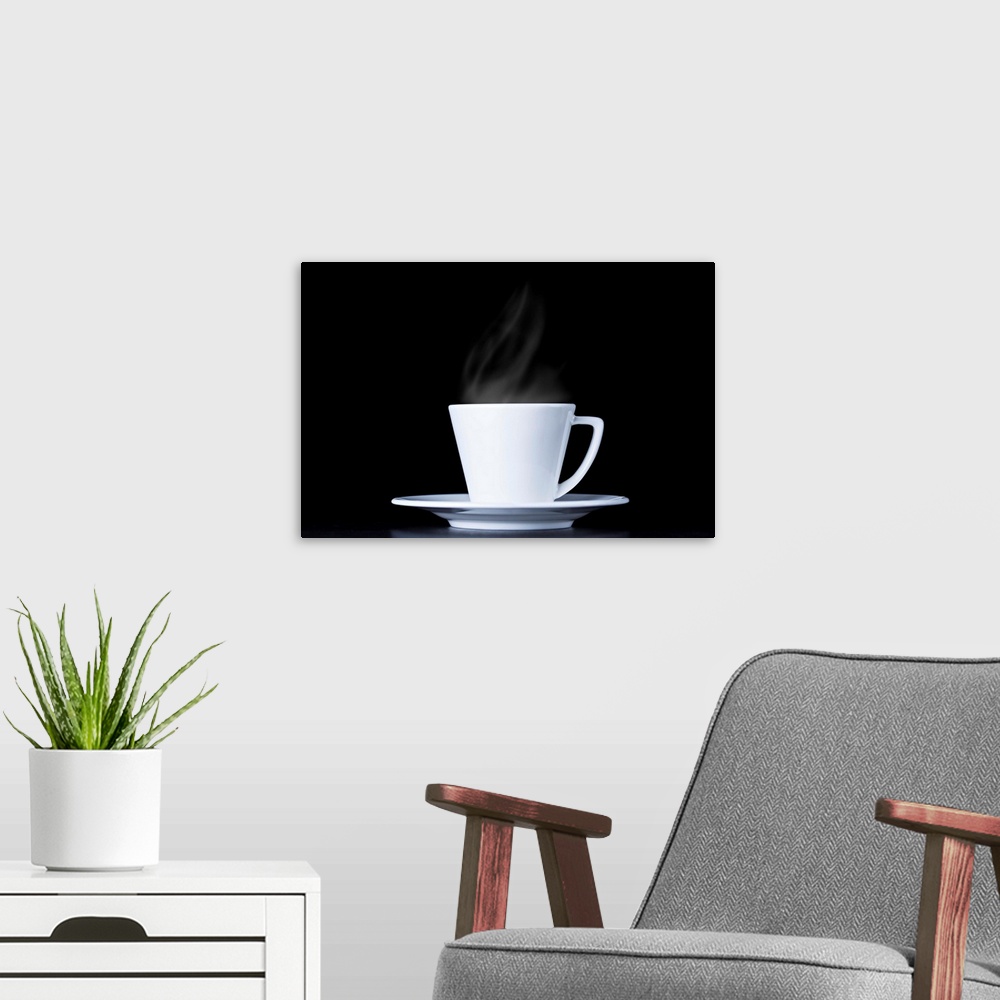 A modern room featuring White coffee cup and steam on black background