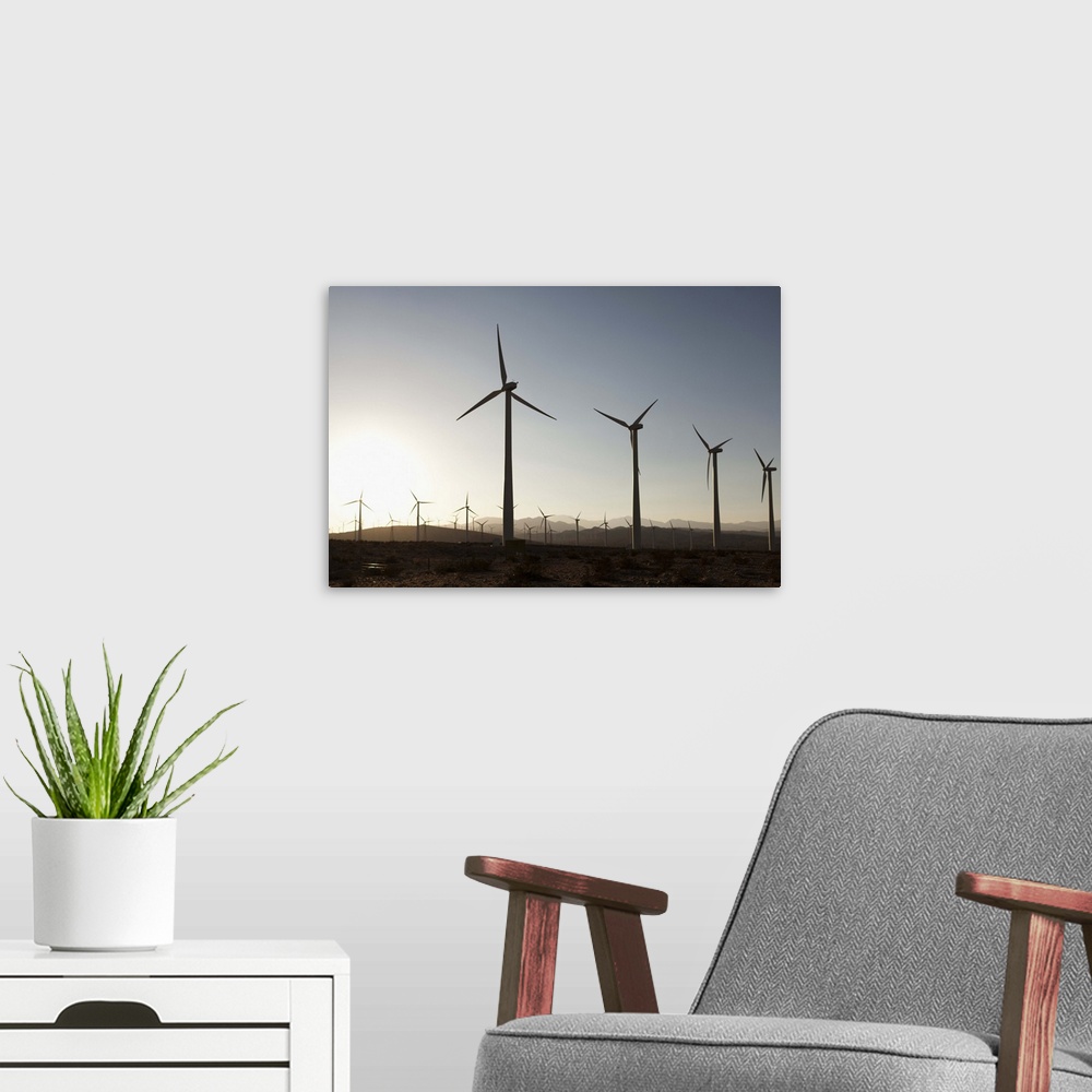 A modern room featuring Wind turbines in a desert landscape
