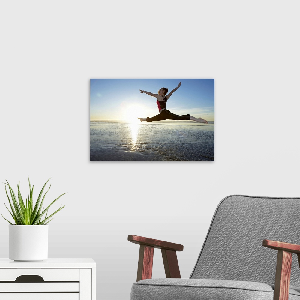 A modern room featuring Woman leaping over the ocean