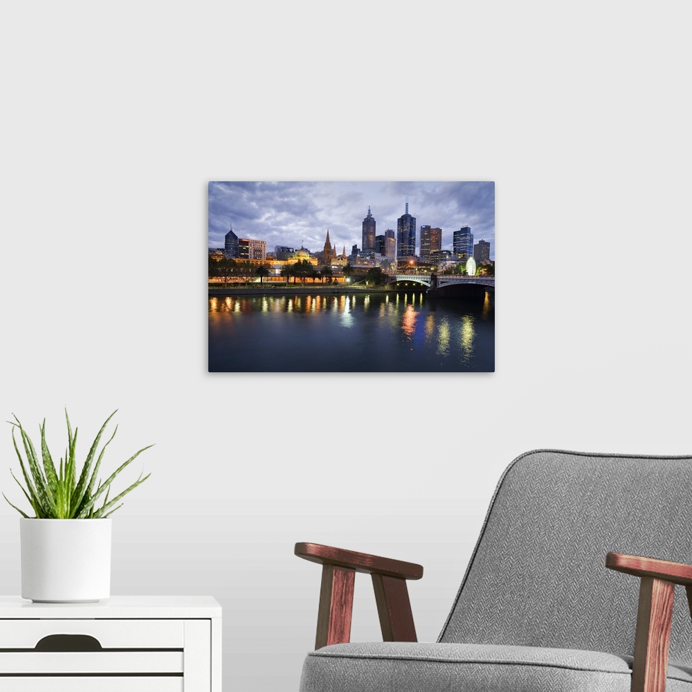 A modern room featuring Australia, Victoria, Melbourne. Yarra River and city skyline by night.