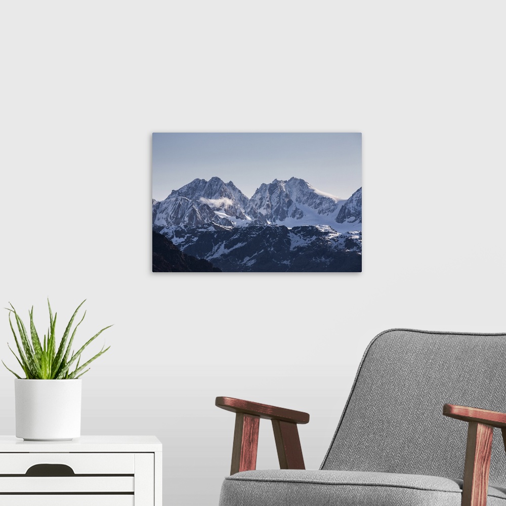 A modern room featuring View of the snowy peak Bernina and peak Roseg at summer, Malenco Valley, Valtellina, Province of ...