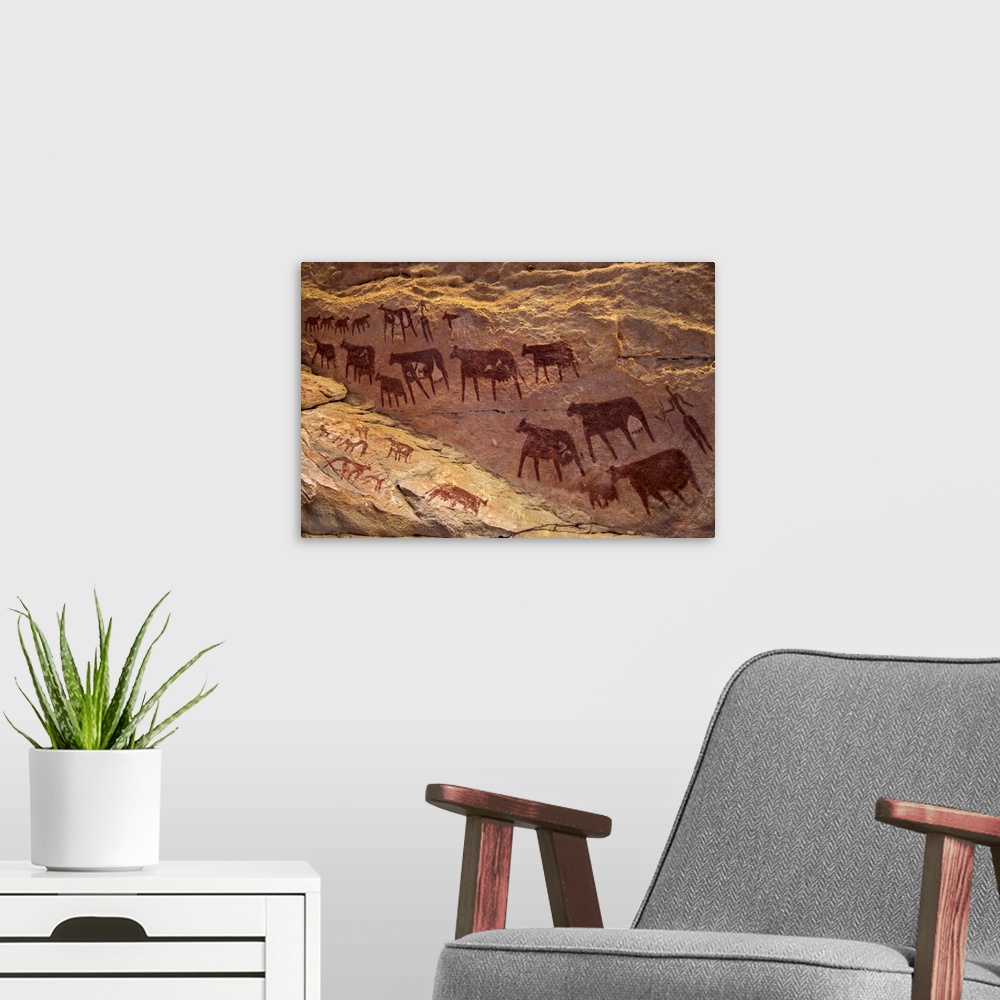A modern room featuring Chad, Taore Koaole, Ennedi, Sahara. Bichrome paintings of cattle and two human figures decorate t...