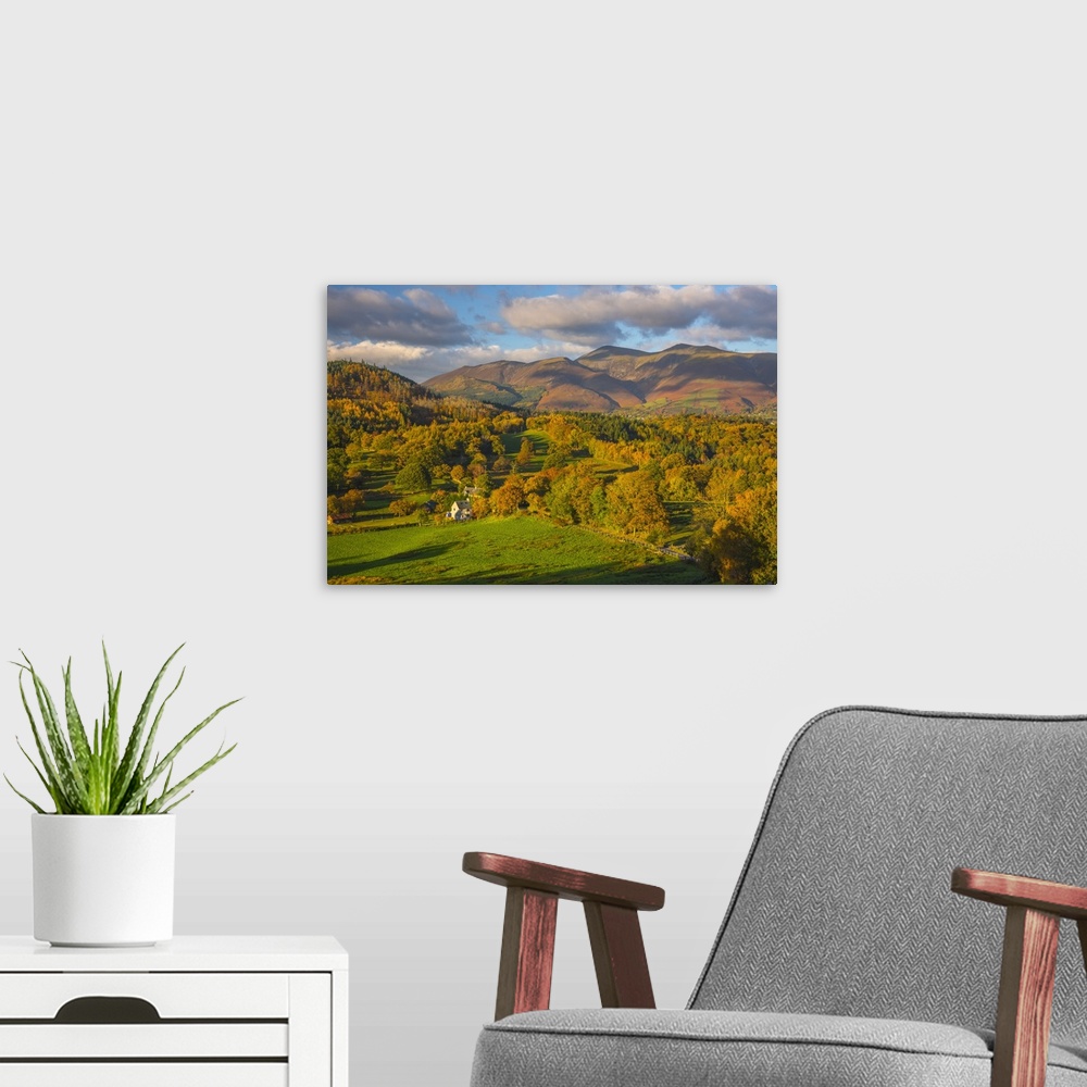 A modern room featuring UK, England, Cumbria, Lake District, Derwentwater, farm house with Skiddaw mountain above Keswick...