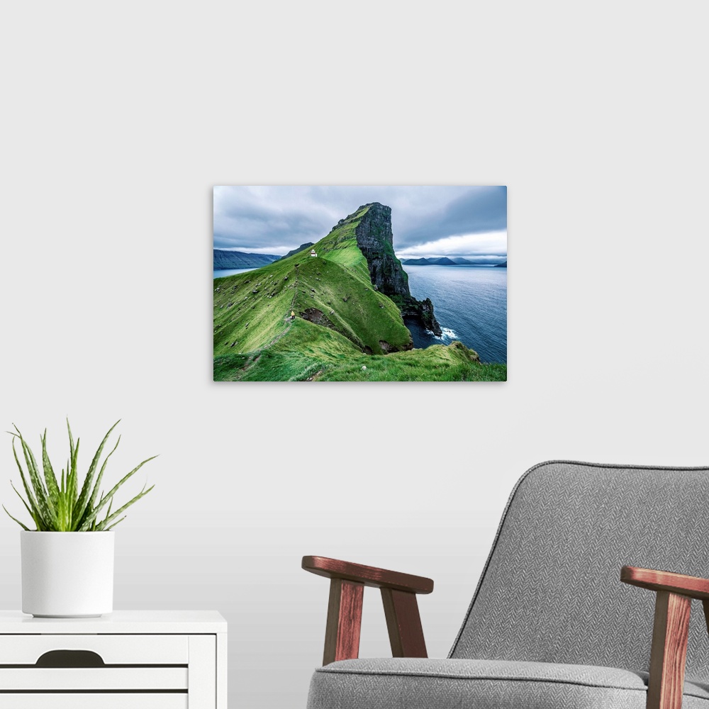 A modern room featuring Hiker near the Kalsoy Lighthouse, Faroe Islands, Europe.