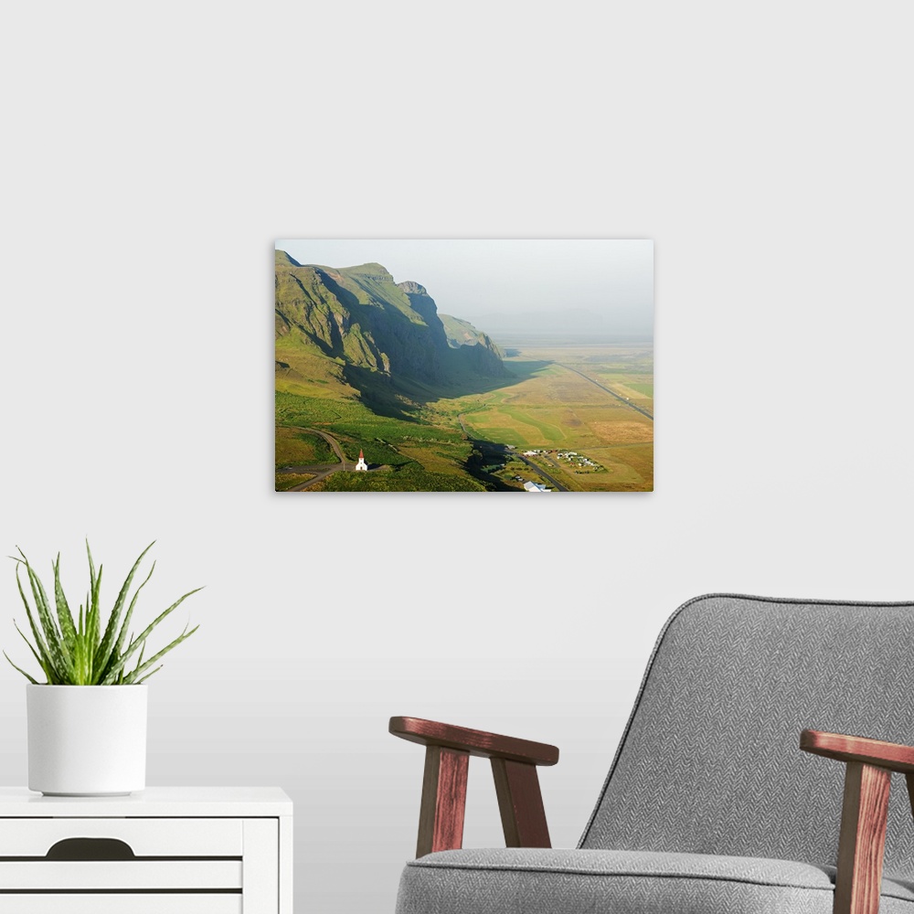 A modern room featuring Iceland, southern region, Vik, church and coastal scenery.