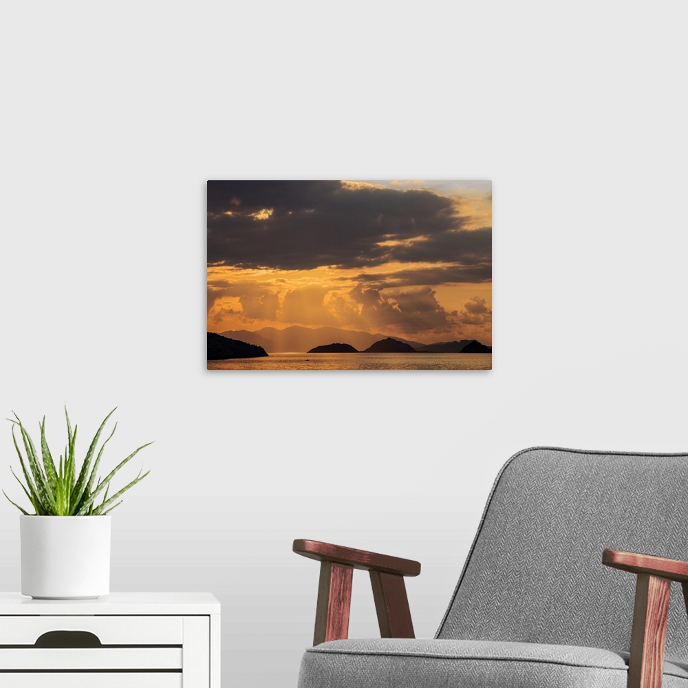 A modern room featuring Indonesia, Lesser Sunda Islands, Rinca. Sunset over Komodo Island.