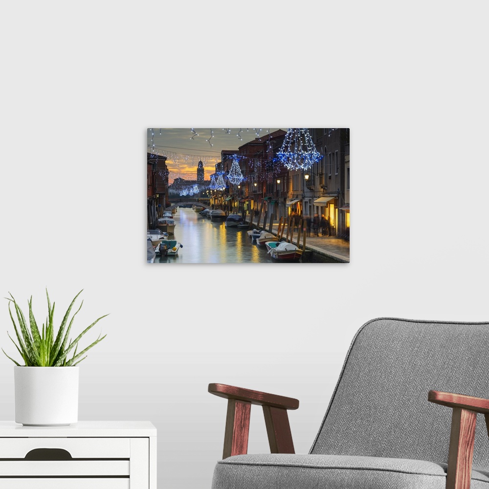 A modern room featuring Europe, Italy, Veneto, Venice, Murano, Christmas decoration on a canal.