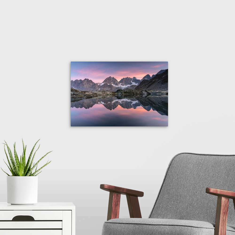 A modern room featuring Lake of Forbici during sunrise and in background Bernina Group, Valmalenco, Valtellina, Sondrio P...