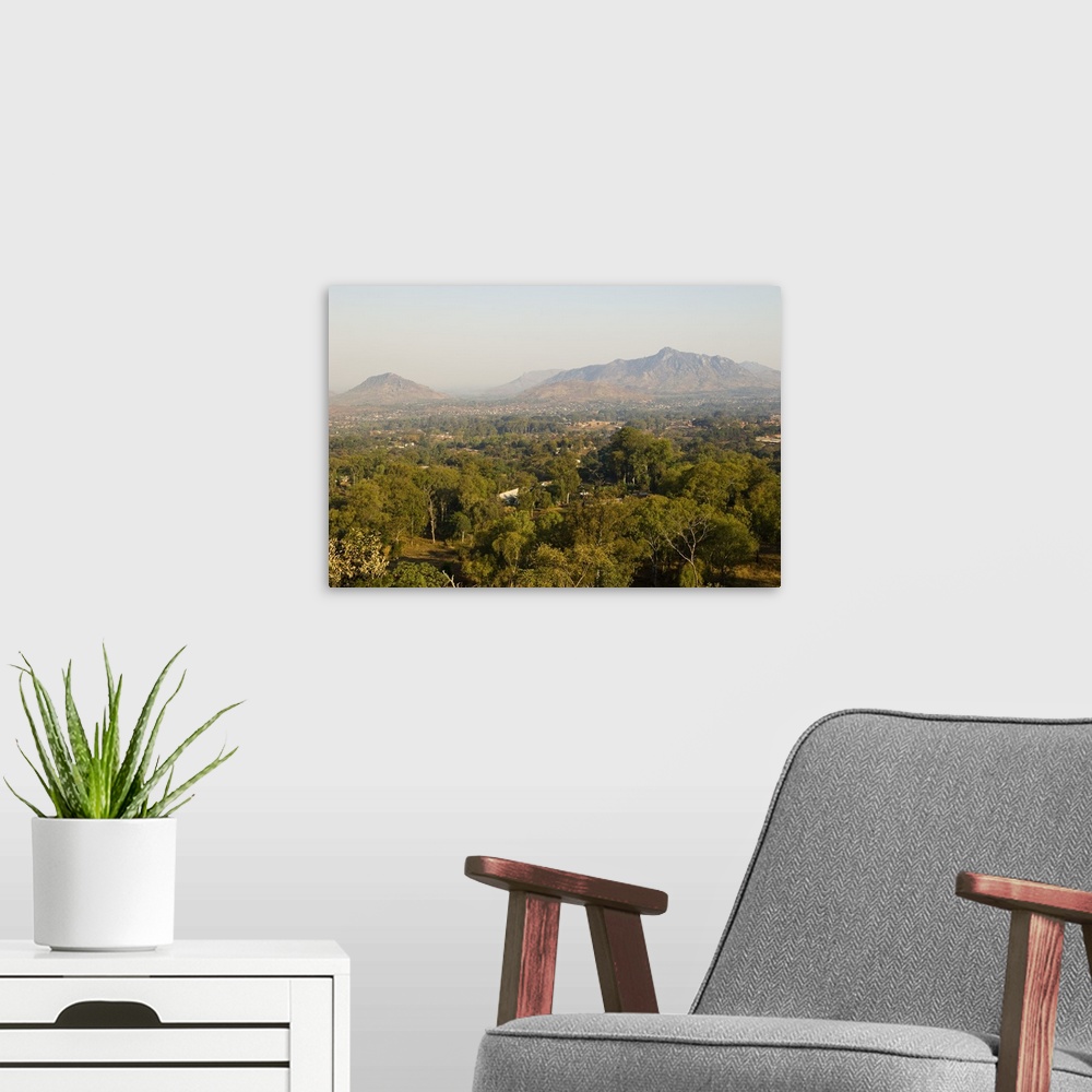 A modern room featuring Malawi, Zomba. View over the town of Zomba from the lower slopes of Zomba Plateau.