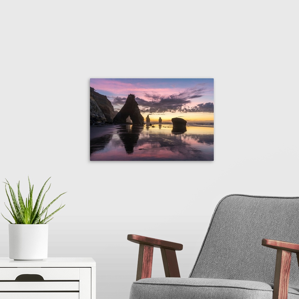 A modern room featuring Rocks reflect with low tide at the Three Sisters beach, at sunset. Tongaporutu, New Plymouth dist...