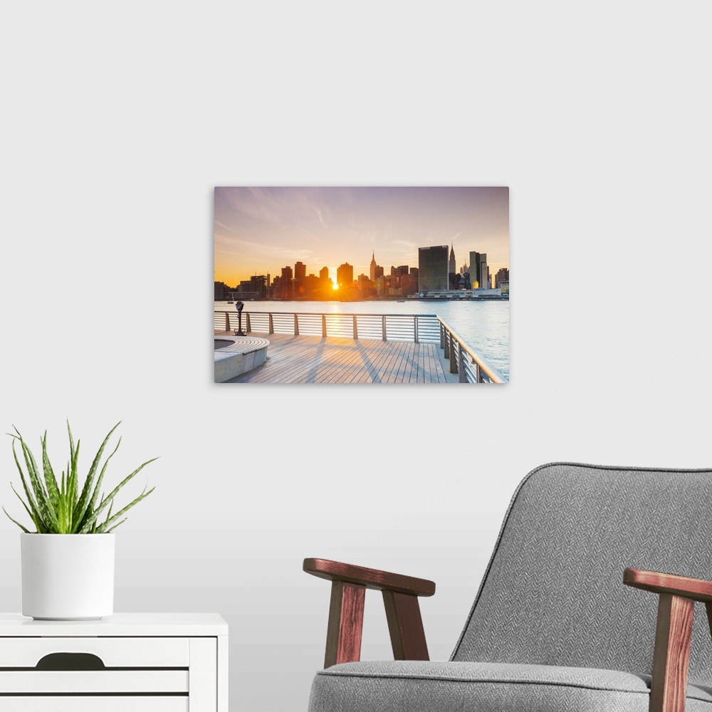 A modern room featuring Sunset over the Manhattan skyline from Gantry Plaza, New York, USA.