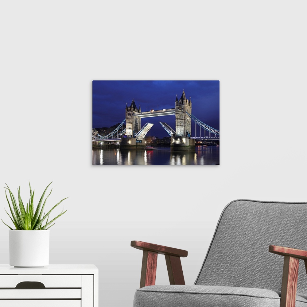 A modern room featuring The famous Tower Bridge over the River Thames in London.