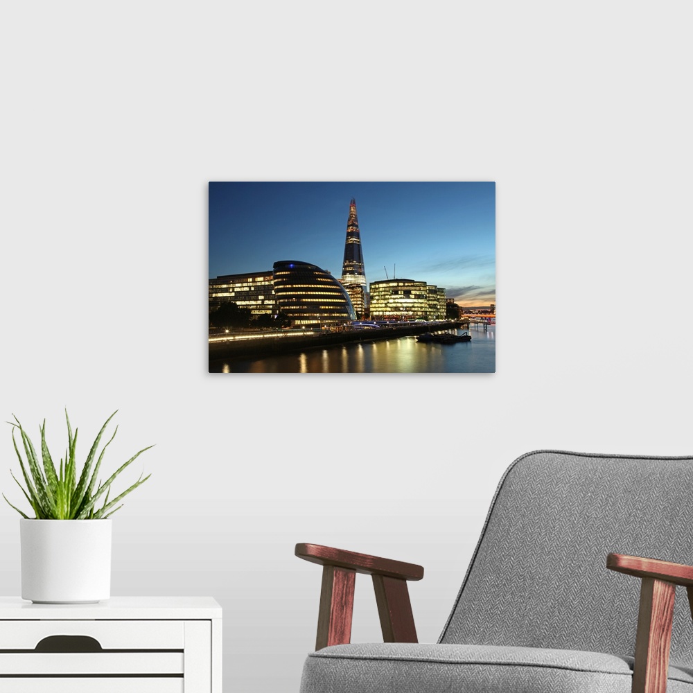 A modern room featuring The Shard is the tallest building in Western Europe and was completed in 2012. On the left is the...