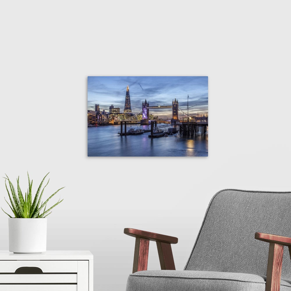 A modern room featuring The Tower Bridge in London seen from the east at dusk. In the background on the left the Shard sk...