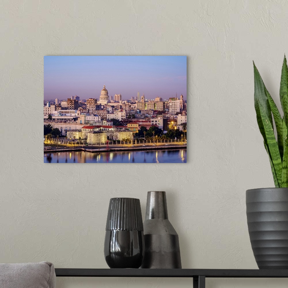 A modern room featuring View over Castle of the Royal Force and Habana Vieja towards El Capitolio at dawn, Havana, La Hab...