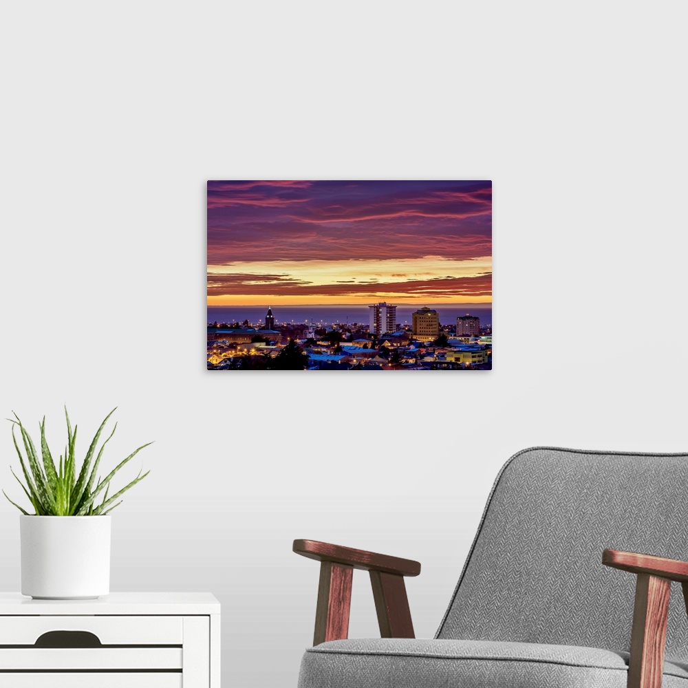 A modern room featuring View over city towards Strait of Magellan at sunrise, Punta Arenas, Magallanes Province, Patagoni...
