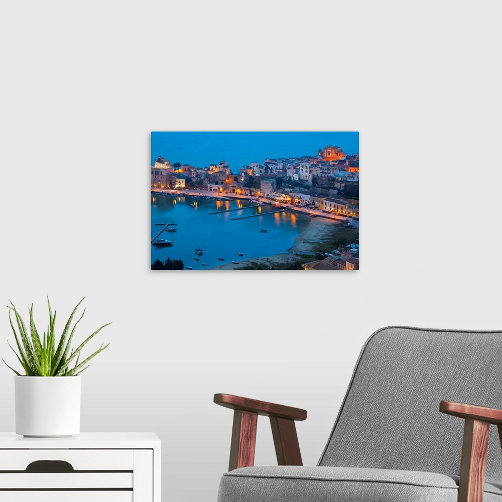 A modern room featuring View over harbour at dusk, Castellammare del Golfo, Sicily, Italy