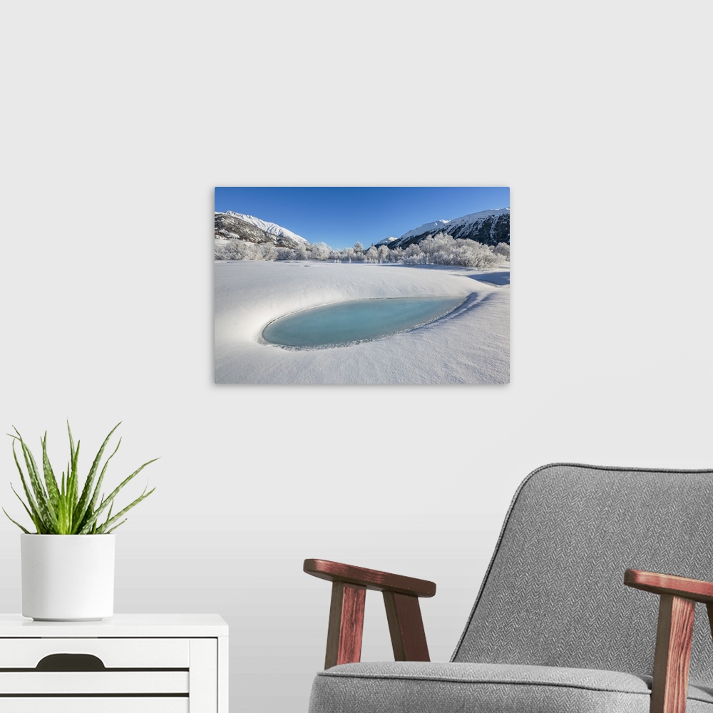 A modern room featuring Winter landscape with trees covered in hoarfrost and frozen pond. Celerina, Engadin, Graubunden, ...