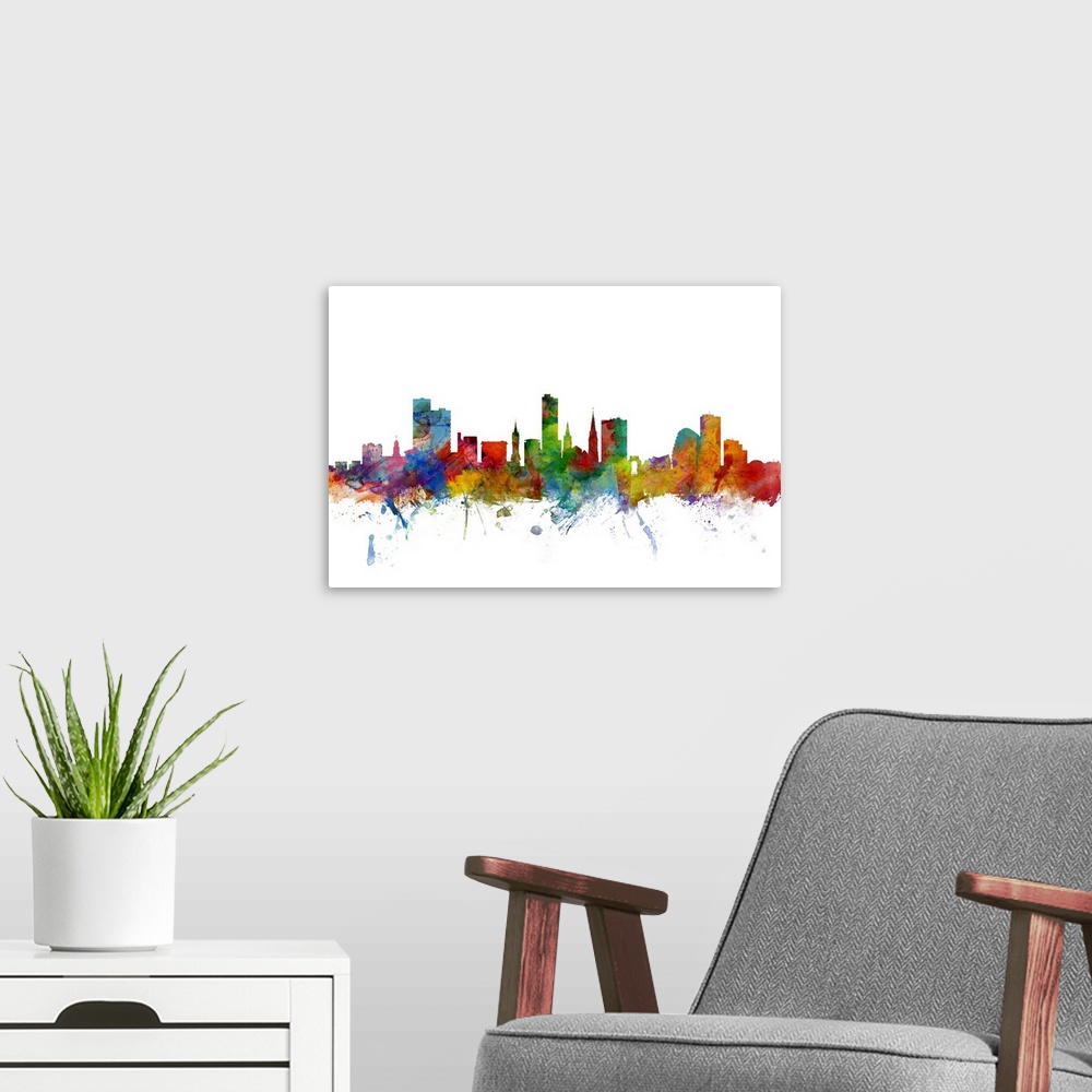 A modern room featuring Contemporary piece of artwork of the Leicester skyline made of colorful paint splashes.
